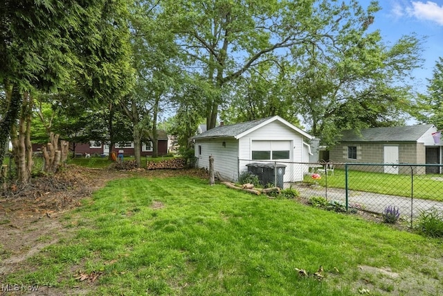 447 Allenford St, Akron, OH 44314 - view of yard featuring a detached garage, an outdoor structure, and driveway