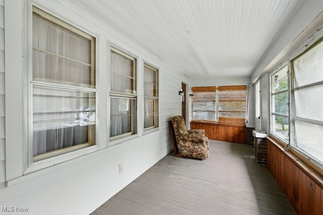 447 Allenford St, Akron, OH 44314 - unfurnished sunroom featuring wood walls and wood finished floors