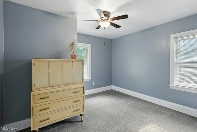 447 Allenford St, Akron, OH 44314 - bedroom with dark carpet and a ceiling fan