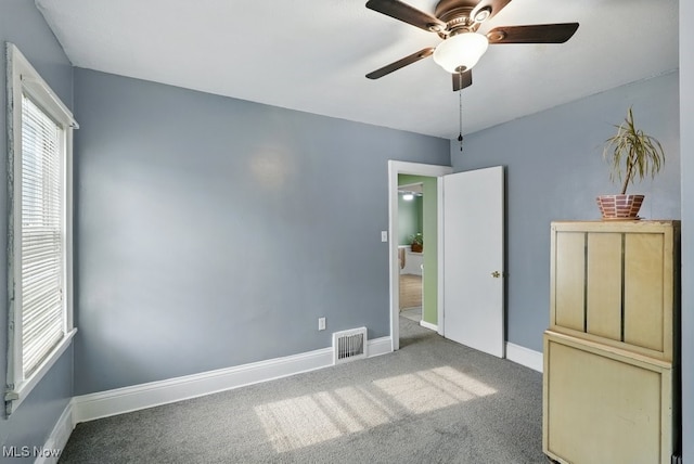 447 Allenford St, Akron, OH 44314 - unfurnished bedroom featuring carpet floors and a ceiling fan