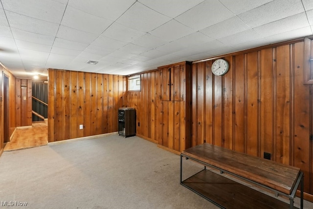 447 Allenford St, Akron, OH 44314 - basement featuring carpet floors, wooden walls, and stairs