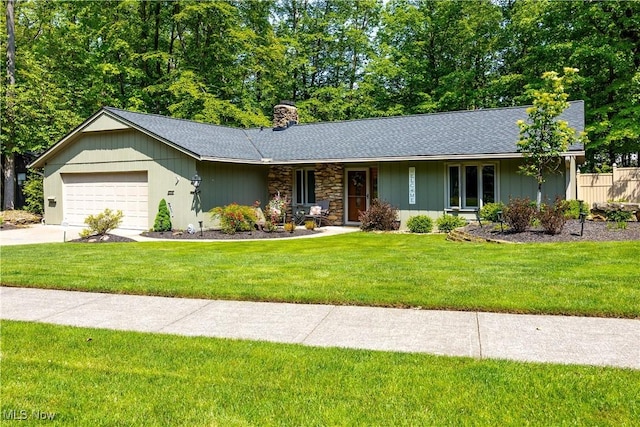 12145 The Blfs, Strongsville, OH 44136 - ranch-style home featuring a chimney, an attached garage, a front lawn, concrete driveway, and a shingled roof