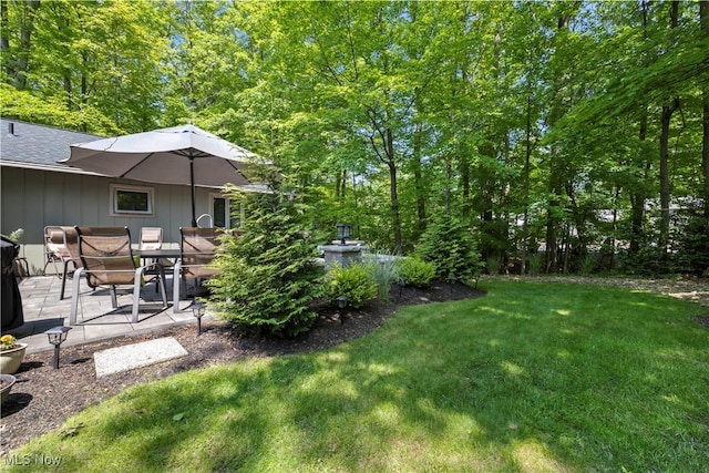 12145 The Blfs, Strongsville, OH 44136 - view of grassy yard featuring a patio