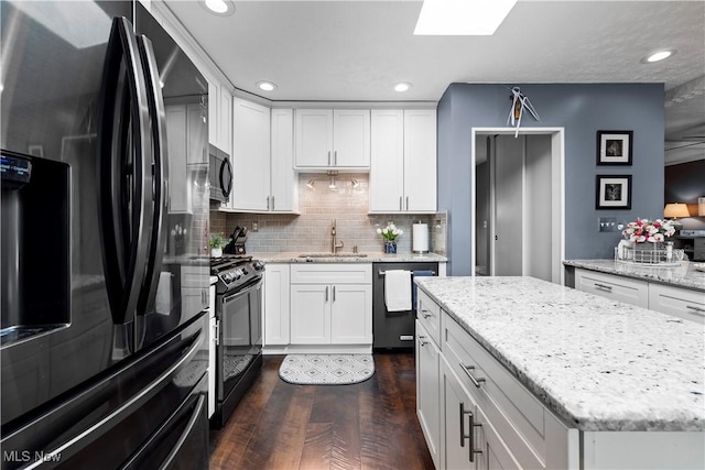12145 The Blfs, Strongsville, OH 44136 - kitchen featuring black appliances, dark wood-type flooring, white cabinetry, and recessed lighting
