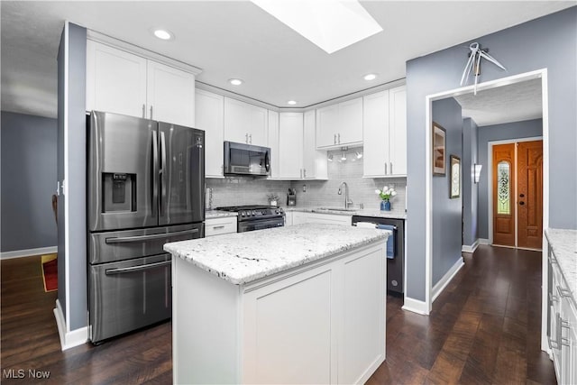 12145 The Blfs, Strongsville, OH 44136 - kitchen with appliances with stainless steel finishes, decorative backsplash, white cabinets, dark wood finished floors, and recessed lighting