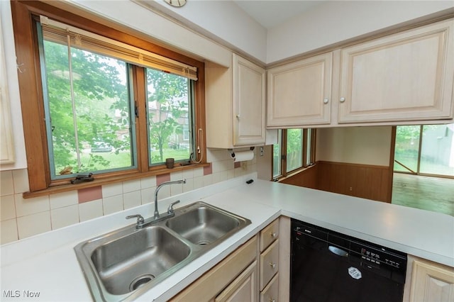2375 Glendon Rd, University Heights, OH 44118 - kitchen featuring dishwasher, light countertops, decorative backsplash, and a wainscoted wall