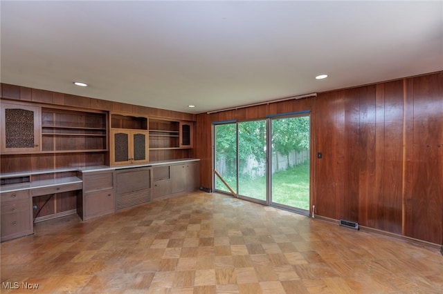 2375 Glendon Rd, University Heights, OH 44118 - unfurnished office featuring built in desk, wood walls, and recessed lighting