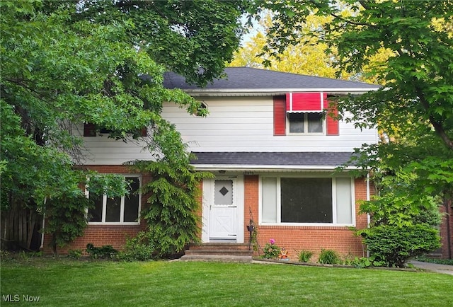 2375 Glendon Rd, University Heights, OH 44118 - view of front of home featuring brick siding, a front lawn, and entry steps