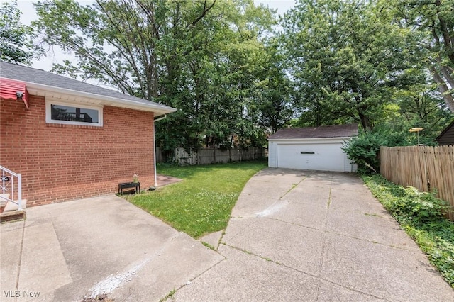 2375 Glendon Rd, University Heights, OH 44118 - view of yard featuring a detached garage and an outbuilding