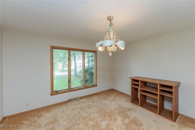 2375 Glendon Rd, University Heights, OH 44118 - empty room featuring a chandelier and carpet floors