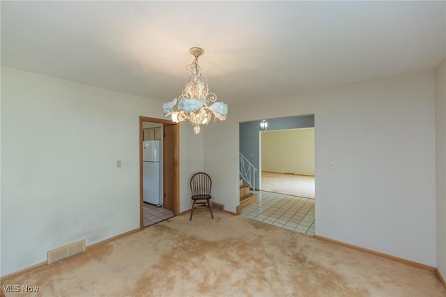 2375 Glendon Rd, University Heights, OH 44118 - carpeted empty room featuring stairs and a chandelier