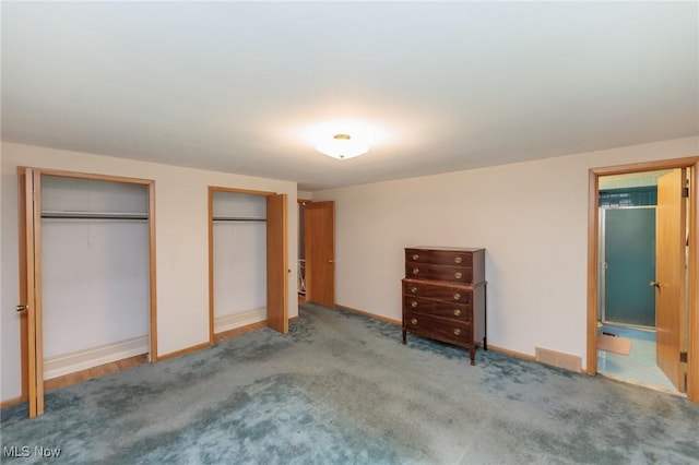 2375 Glendon Rd, University Heights, OH 44118 - unfurnished bedroom featuring two closets and carpet