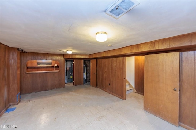 2375 Glendon Rd, University Heights, OH 44118 - finished basement with wooden walls, stairs, and light floors