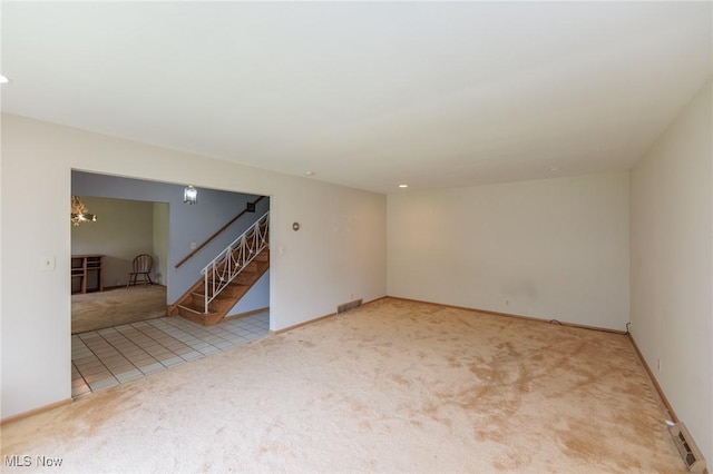 2375 Glendon Rd, University Heights, OH 44118 - unfurnished living room with carpet floors, stairway, and recessed lighting