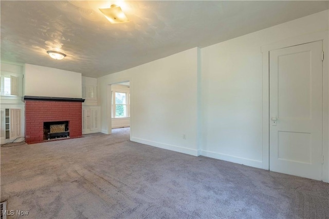 996 Peerless Ave, Akron, OH 44320 - unfurnished living room featuring carpet flooring and a fireplace