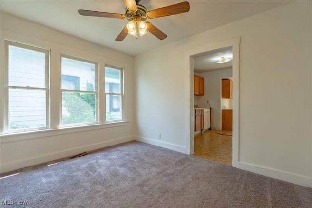996 Peerless Ave, Akron, OH 44320 - spare room featuring light colored carpet and ceiling fan