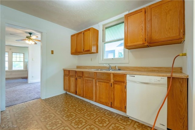 996 Peerless Ave, Akron, OH 44320 - kitchen with dishwasher, light countertops, a ceiling fan, light floors, and brown cabinetry