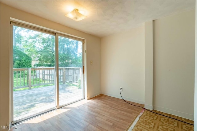 996 Peerless Ave, Akron, OH 44320 - empty room featuring baseboards and light wood-type flooring