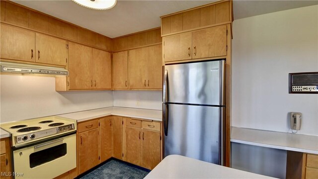 1592 Pleasant Vw, Dover, OH 44612 - kitchen with freestanding refrigerator, stove, under cabinet range hood, and light countertops