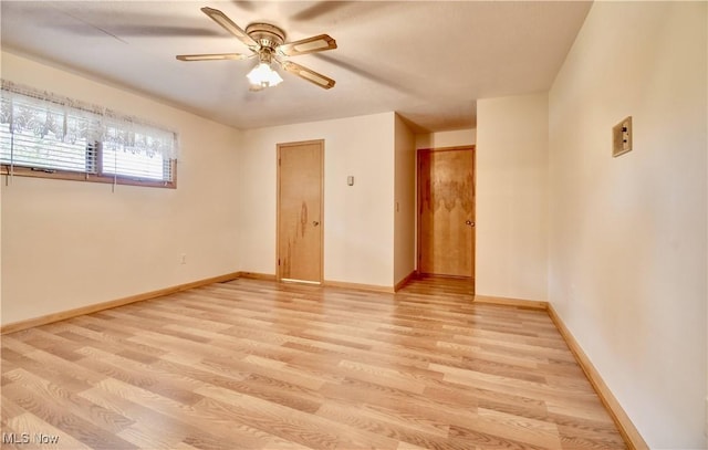 1592 Pleasant Vw, Dover, OH 44612 - unfurnished room featuring light wood-style floors and a ceiling fan