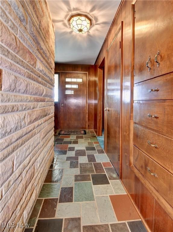 1592 Pleasant Vw, Dover, OH 44612 - hall with stone finish flooring and wood walls