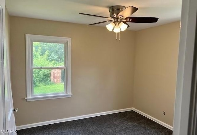 920 Washington Ave, Girard, OH 44420 - spare room with plenty of natural light, dark colored carpet, and a ceiling fan