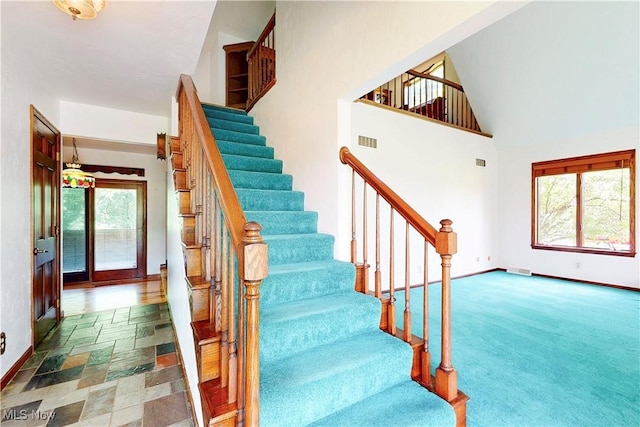 5864 State Route 213, Toronto, OH 43964 - staircase featuring high vaulted ceiling and baseboards