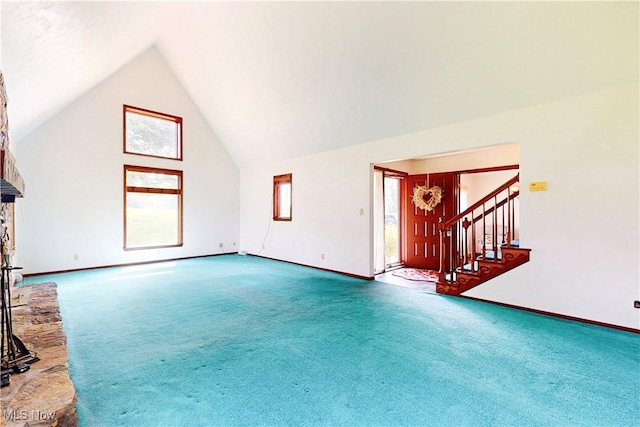 5864 State Route 213, Toronto, OH 43964 - unfurnished living room featuring carpet floors, stairway, and high vaulted ceiling