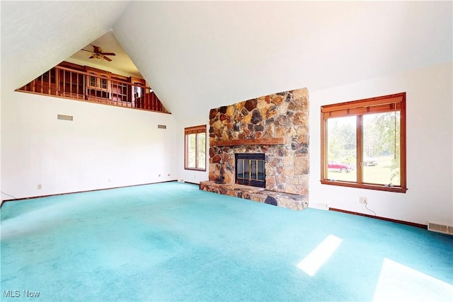 5864 State Route 213, Toronto, OH 43964 - unfurnished living room with carpet, high vaulted ceiling, a stone fireplace, and ceiling fan