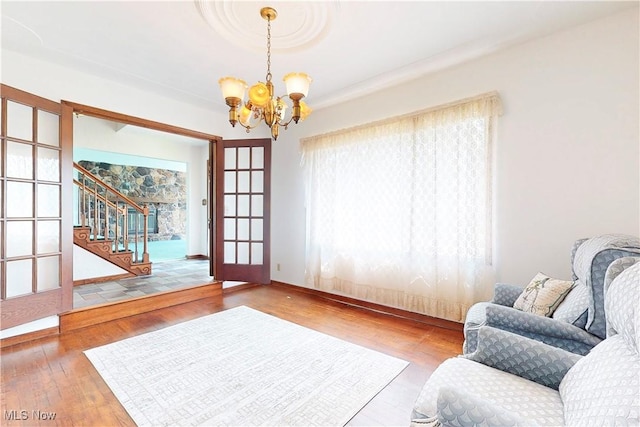 5864 State Route 213, Toronto, OH 43964 - sitting room with a chandelier, stairs, and wood finished floors