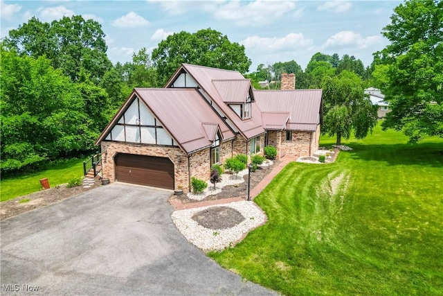 5864 State Route 213, Toronto, OH 43964 - tudor-style house featuring driveway, a front lawn, stone siding, and a chimney