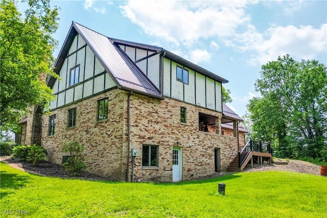 5864 State Route 213, Toronto, OH 43964 - view of home's exterior featuring stairs, a lawn, a wooden deck, brick siding, and a metal roof
