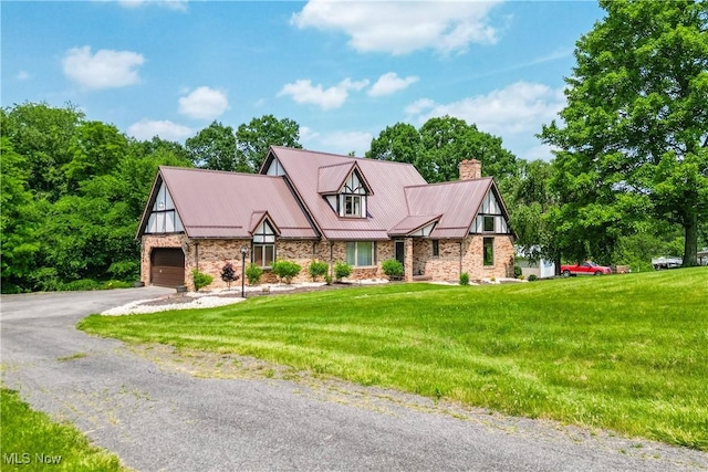 5864 State Route 213, Toronto, OH 43964 - view of front facade featuring a chimney, driveway, a front lawn, an attached garage, and a metal roof