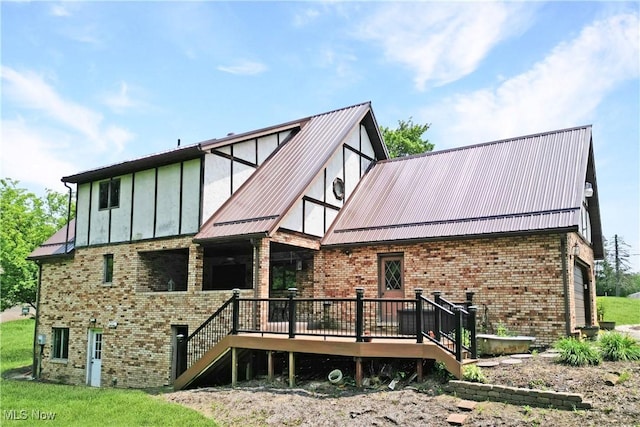 5864 State Route 213, Toronto, OH 43964 - rear view of property featuring brick siding, a deck, a metal roof, and a standing seam roof