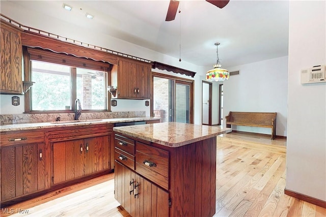 5864 State Route 213, Toronto, OH 43964 - kitchen with light wood-style flooring, a center island, healthy amount of natural light, and pendant lighting