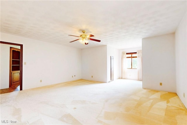 5864 State Route 213, Toronto, OH 43964 - empty room with ceiling fan and light colored carpet
