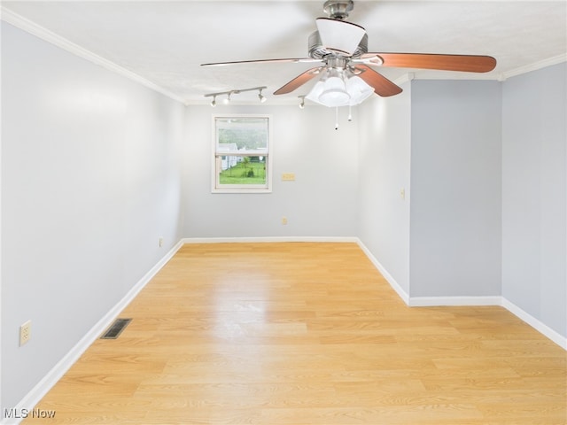 1317 Crescent St, Parkersburg, WV 26101 - spare room featuring light wood-type flooring, crown molding, and a ceiling fan