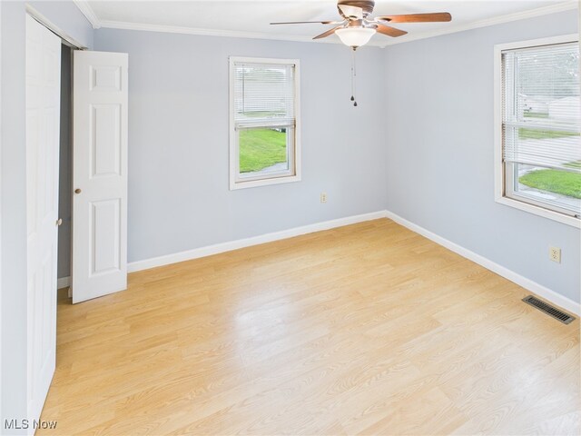 1317 Crescent St, Parkersburg, WV 26101 - spare room with a ceiling fan, light wood-type flooring, and crown molding