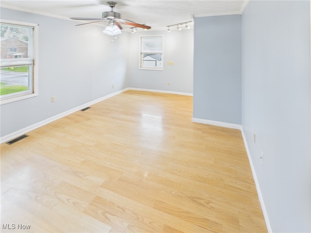 1317 Crescent St, Parkersburg, WV 26101 - spare room featuring a ceiling fan, light wood finished floors, crown molding, and track lighting