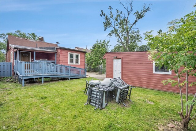4532 W 172nd St, Cleveland, OH 44135 - view of grassy yard with a deck and an outbuilding