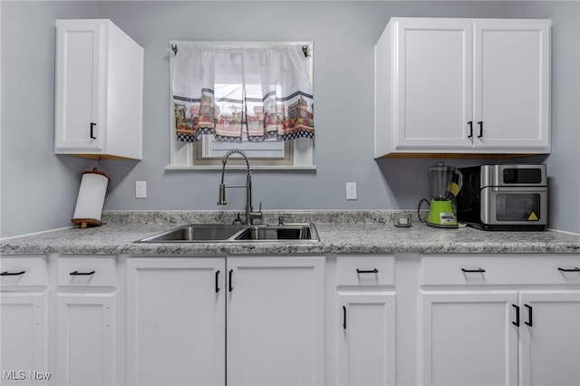 4532 W 172nd St, Cleveland, OH 44135 - kitchen with a sink and white cabinetry