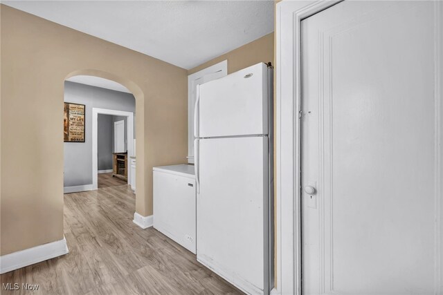 4532 W 172nd St, Cleveland, OH 44135 - corridor featuring arched walkways and light wood finished floors
