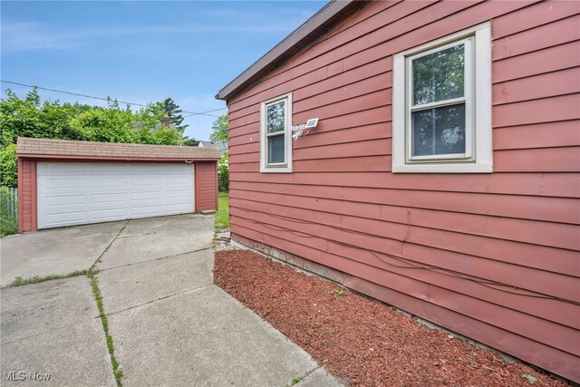 4532 W 172nd St, Cleveland, OH 44135 - view of home's exterior featuring an outdoor structure and a detached garage