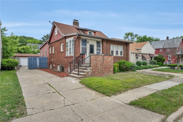 4532 W 172nd St, Cleveland, OH 44135 - bungalow with a front yard, brick siding, a chimney, and an outbuilding