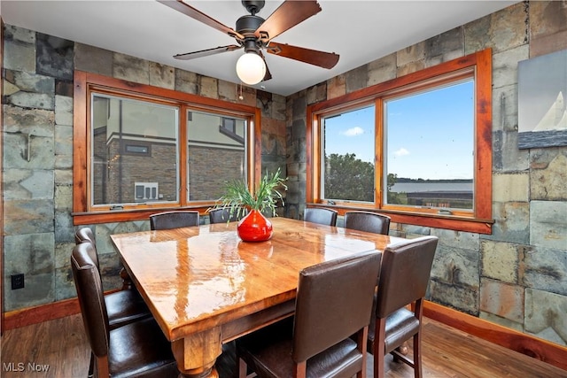 731 Cedar Point Rd, Sandusky, OH 44870 - dining room with hardwood / wood-style flooring and a ceiling fan
