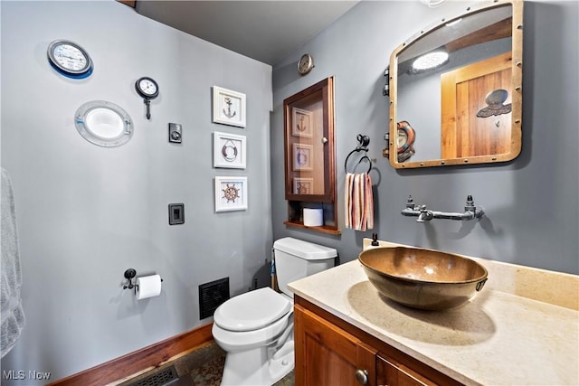 731 Cedar Point Rd, Sandusky, OH 44870 - bathroom with toilet and vanity