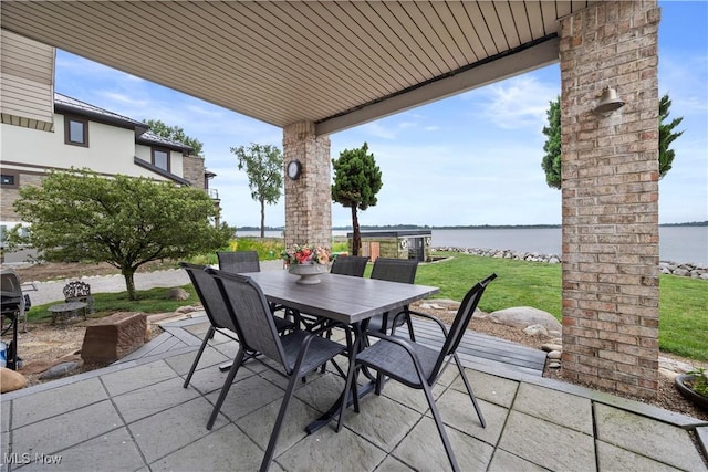 731 Cedar Point Rd, Sandusky, OH 44870 - view of patio featuring a water view and outdoor dining area