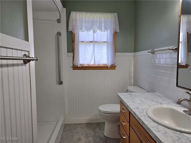 36277 Butcher Rd, Salem, OH 44460 - bathroom featuring a shower, vanity, and wainscoting