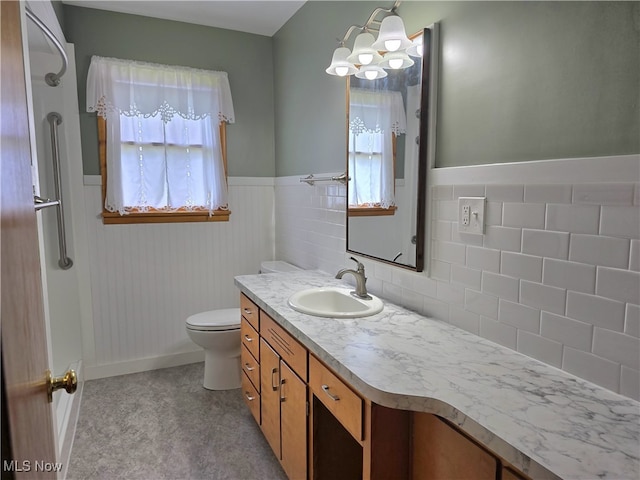 36277 Butcher Rd, Salem, OH 44460 - bathroom with vanity, a chandelier, and a wainscoted wall