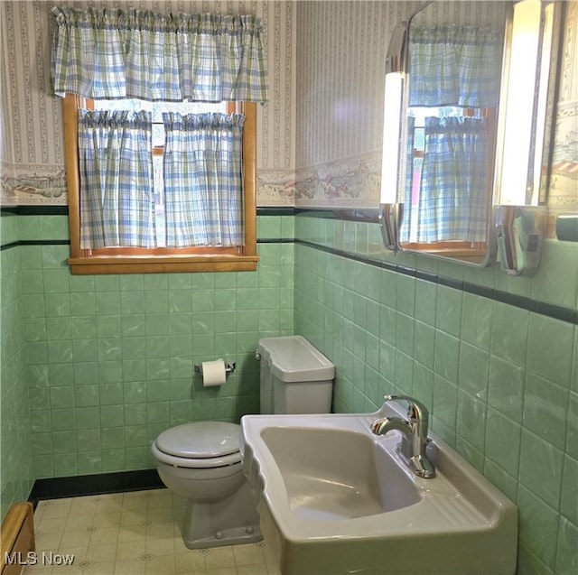36277 Butcher Rd, Salem, OH 44460 - half bath featuring tile walls, wallpapered walls, and a wainscoted wall